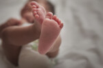 Close up of newborn baby girl's feet