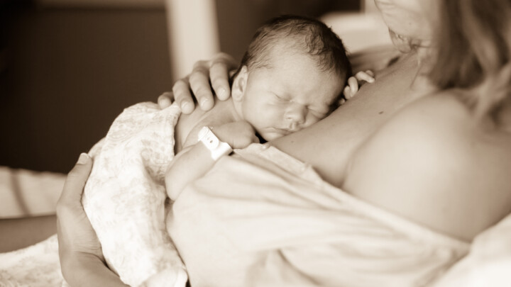 A newborn and mother at maternity ward