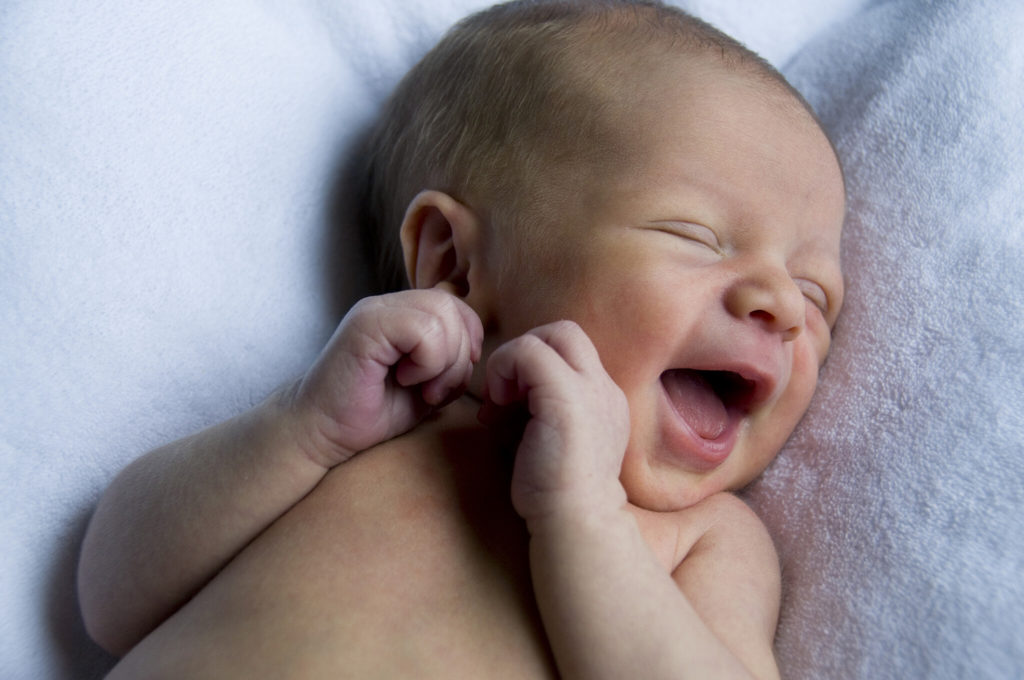 Portrait of newborn baby smiling