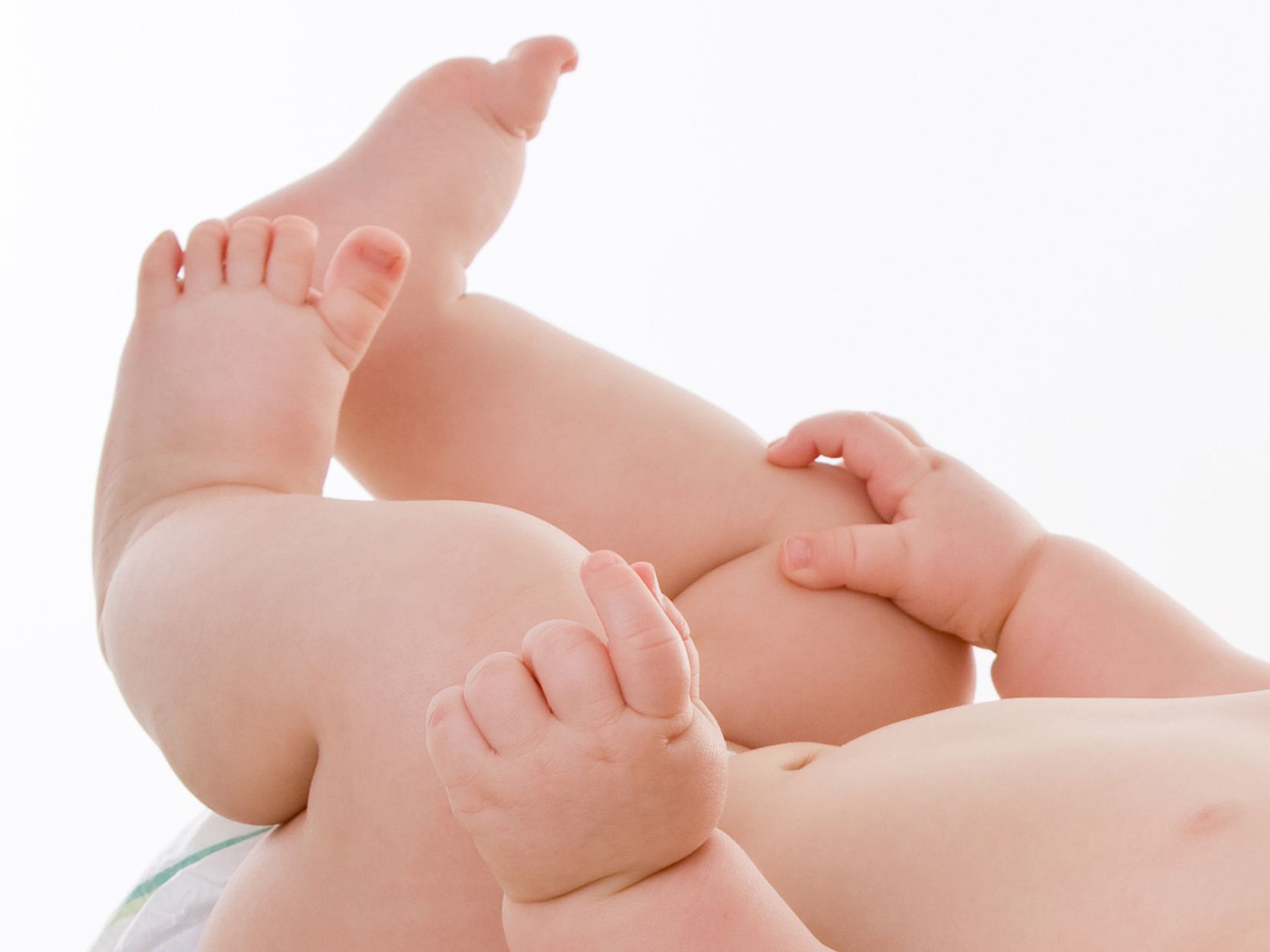 Close-up of baby feet and hands
